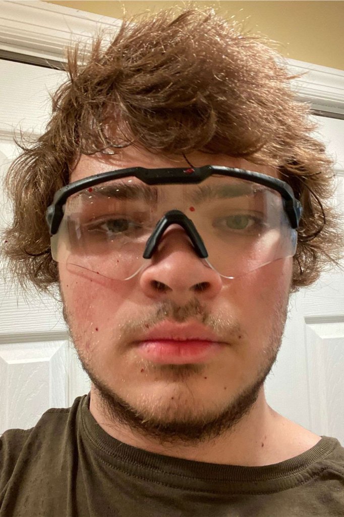 Payton Gendron posted disturbing photos of the cat's decapitated body and his own face sprayed with splatters of blood.